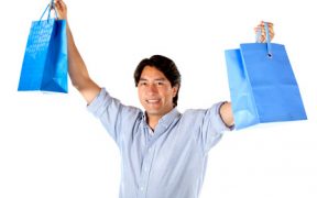 Excited man with shopping bags